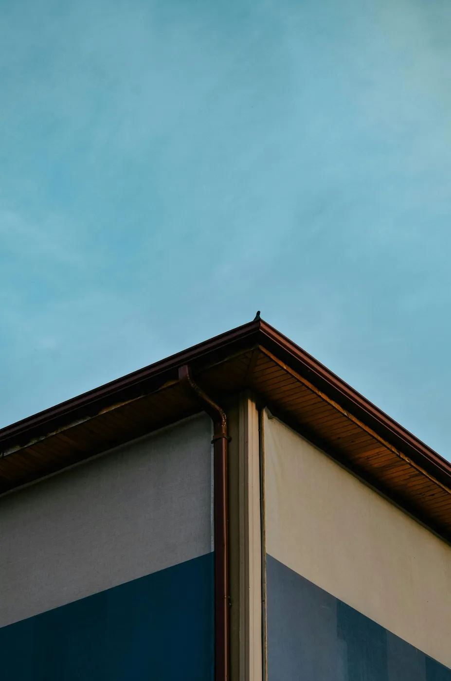Roof corner and soffit under a blue sky
