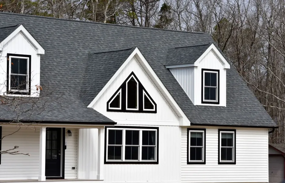 Seamless gutters on a white modern farmhouse with dormers in Egg Harbor Twp, NJ