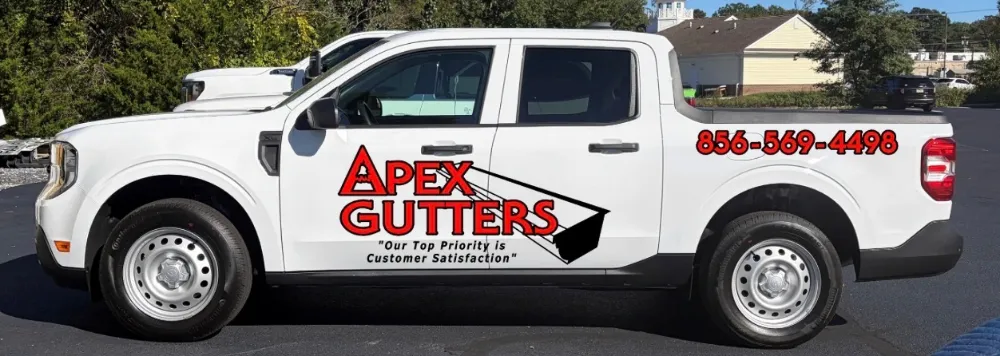 Apex Gutters LLC service truck showing the West Berlin phone number (856) 569-4498