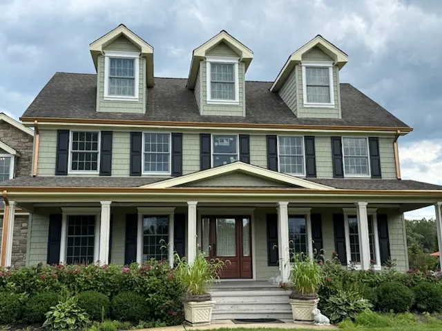 Seamless gutters on a colonial home with three dormers in West Berlin, NJ