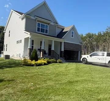 New seamless gutters on a two-story home in West Berlin, NJ